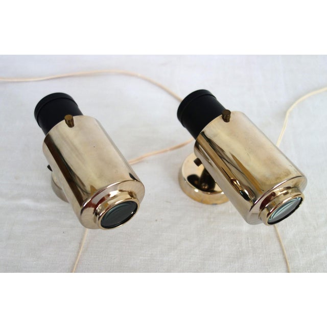Two Zodiac wall lights - Jacques Biny for LITA, made in France in the 1950s. Black metal and gold-plated brass structure,...