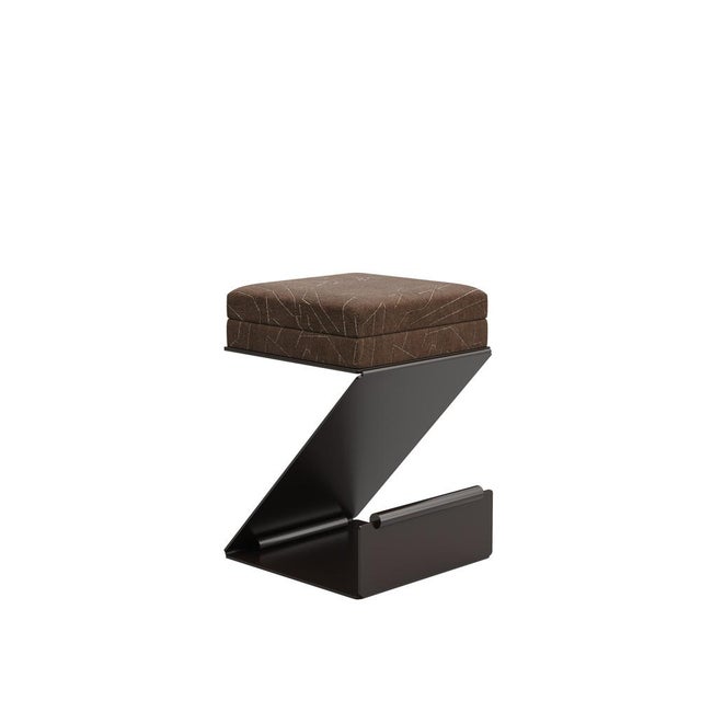 The Lombard Bar Stool captures motion in a single glance: its base, defined by sharp angles and deliberate shifts, echoes...