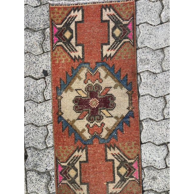 This is a vintage Turkish Oushak rug from the 1960s. The piece was hand-knotted.