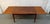 A beautifully crafted Mid-Century Modern teak draw-leaf dining table by Vejle Stole & Møbelfabrik, showcasing the timeless...