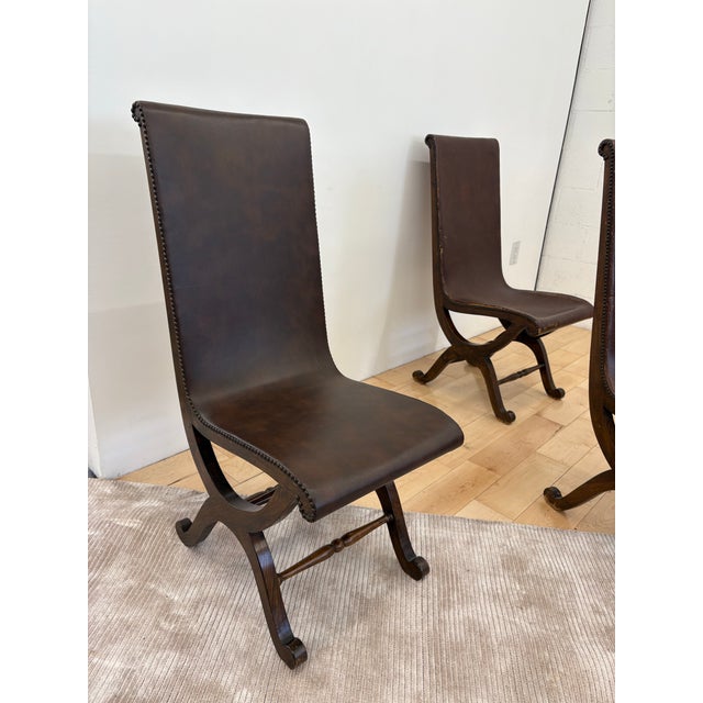 Designed by French-Spanish designer Pierre Lottier for Almazán in the 1950s, this rare set of four high-back slipper...