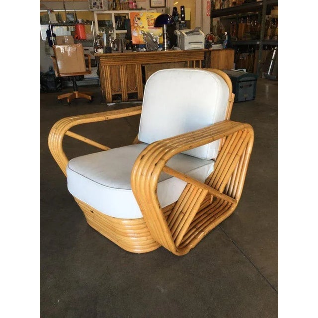 This five-strand, rattan lounge chair features square pretzel arms and a classic stacked base. New Have them made with new...