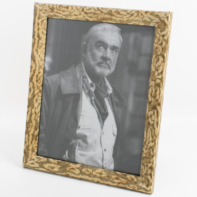 This lovely decorative picture frame was crafted in France in the 1960s. The wood frame structure is wrapped with a...