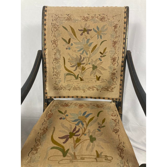 A fully original and unrestored folding armchair from the French Second Empire period, circa 1860–1875, retaining its...