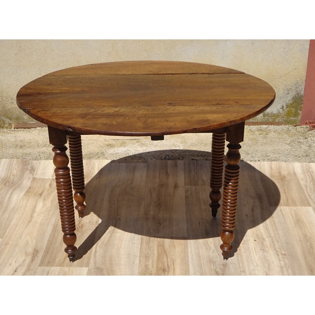 Small dining table for 2 to 4 people or console table. Almost round 90x98cm solid walnut top, 2cm thick. Leaf drops on...
