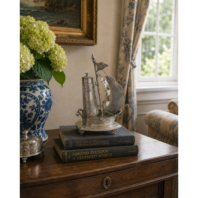 An unusual and beautifully detailed mid-20th century German silver sailing ship nightlight that effortlessly bridges...