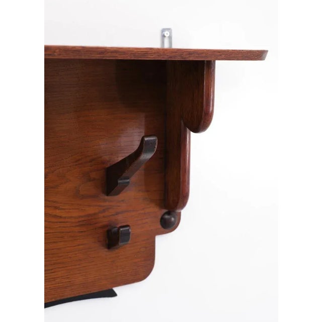 Very nice robust wall Coatrack, solid oak base, comes with 5 large and 5 smaller hooks in. Ebonized Oak. Typical...