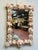 This large charming antique shell mirror showcases a beautifully hand-crafted frame adorned with an abundant arrangement...