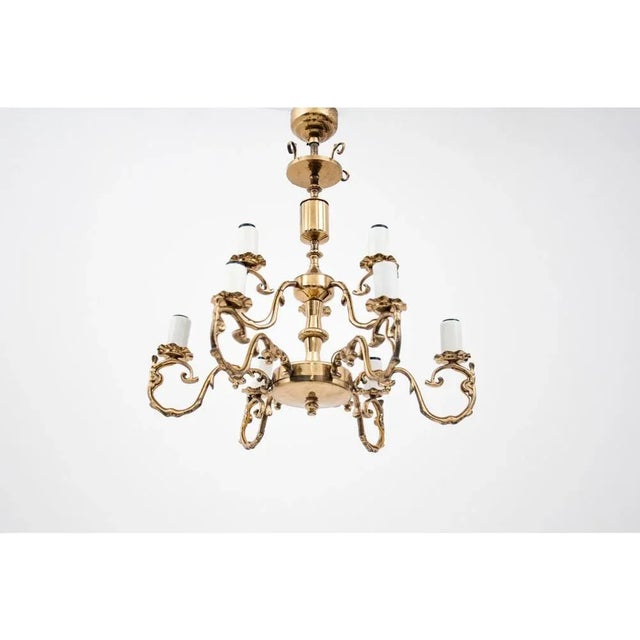 Brass Chandelier, Poland, 1950s, in Flawless conditions. Designed 1950 to 1959 Up to 250V (Europe/UK Standard).The wiring...
