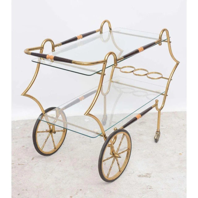 1950 Italian Brass and Glass Trolley Serving or bar cart, 2-tiered with bottle rests, stretcher side bars upper and lower...