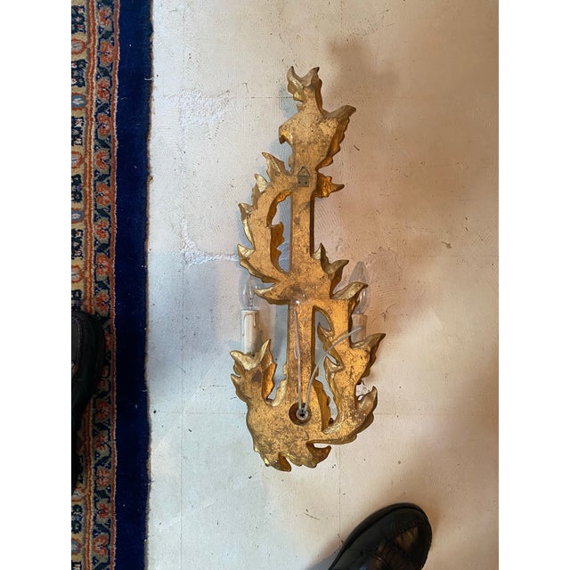 Italian gilded carved electric sconces, pair a right and left. Importer not known, about 20 years old and never installed