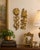 Bring classic Hollywood Regency style to your walls with this striking pair of vintage Syroco floral wall plaques, proudly...