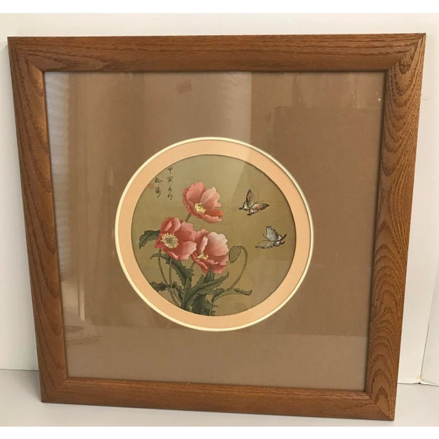 Nice vintage Asian water color on silk featuring poppies and butterflies. Signed and framed.