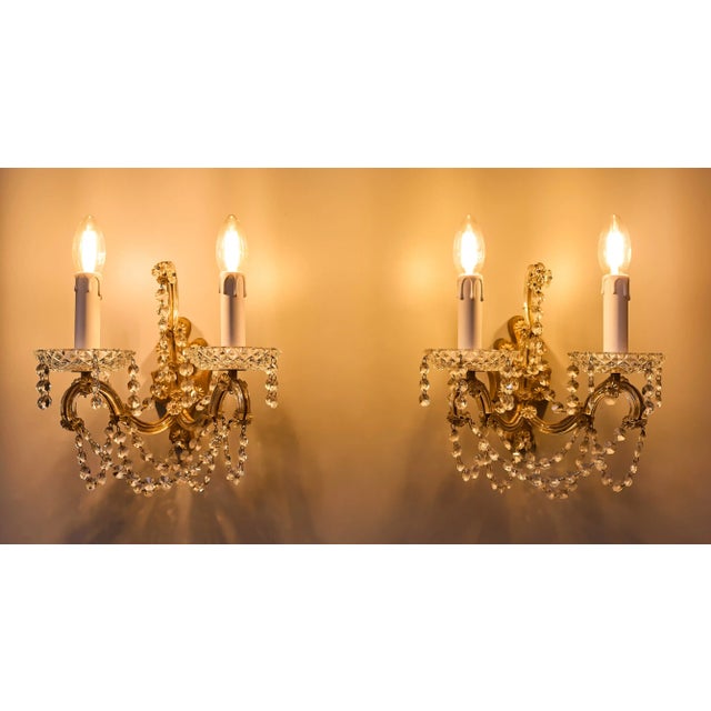 Three wall lamps with crystal trimmings Restored wall lamps with lead crystal trimmings. The lamps are restored - new...