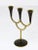 An Austrian modernist three-arm candelabra candleholder, made of brass, partly black-finished. Designed by Richard Rohac,...