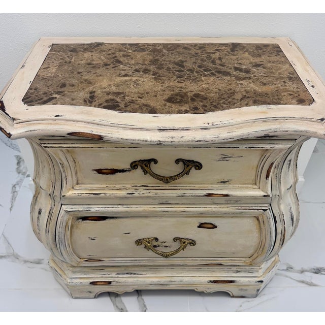 Add timeless European charm to any space with this beautiful vintage French-style bombé chest of drawers. This elegant...