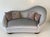 Elegant Italian sofa produced in the 1950s, distinguished by its graceful curved silhouette and sophisticated presence....