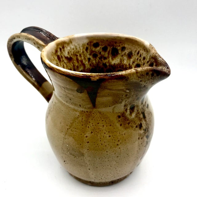 Gorgeous studio pottery creamer with drip glaze and geometric lines creating a highly texture and interesting piece....
