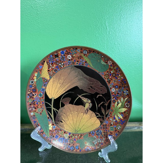 This finely matched pair of Japanese cloisonné enamel dishes, each measuring approximately 8½ inches in diameter, dates to...