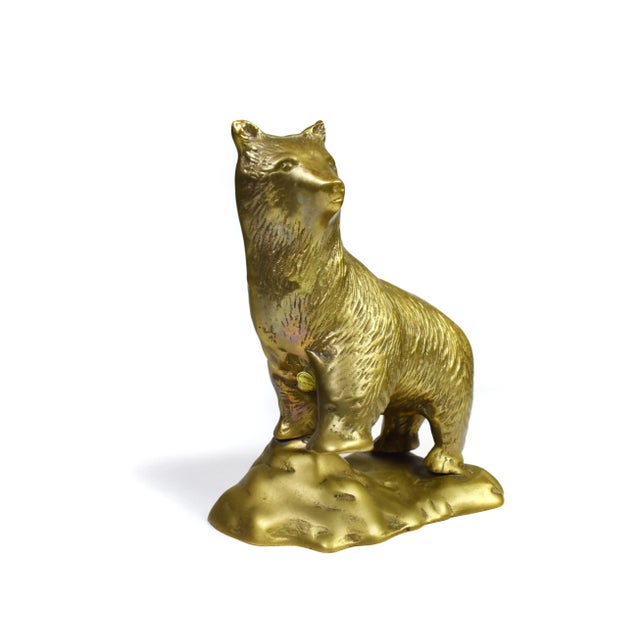 This majestic vintage brass bear figurine is a captivating piece of decor that adds a touch of rustic charm to any space....