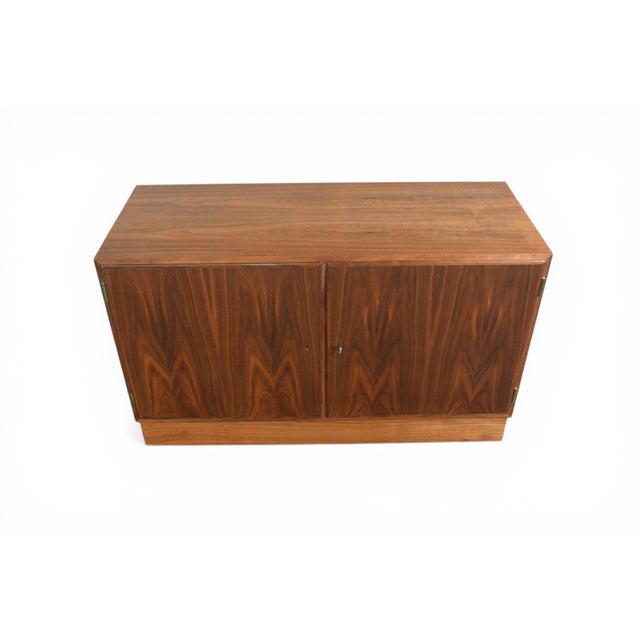 Origin: Denmark Designer: Carlo Jensen Manufacturer: Hundevad + Co Era: 1960s Materials: Walnut Measurements: 42.5" wide x...