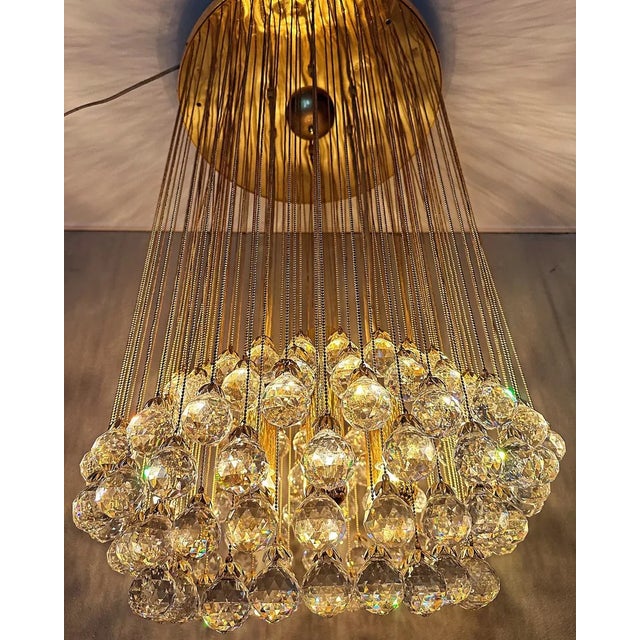 Beautiful mid - century design. 1970s cascade lamp made by german company christophe palme. Round brass base from which...