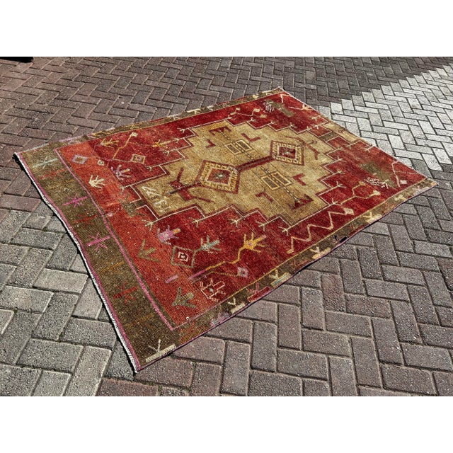This gorgeous traditional hand knotted Vintage Anatolian area rug is approximately 70 years old in excellent vintage...