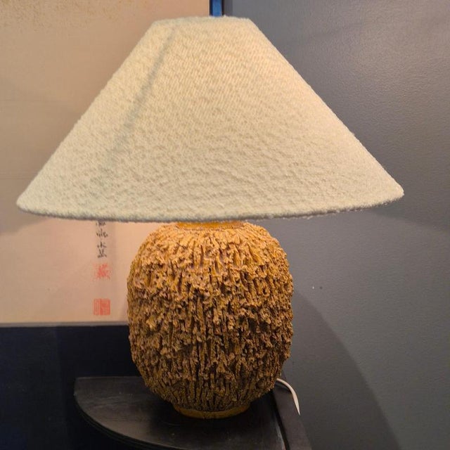 Large Chamotte stoneware "Hedgehog" table lamp by Gunnar Nylund for Rörstrand, designed in 1936. Ochre yellow glaze, brass...