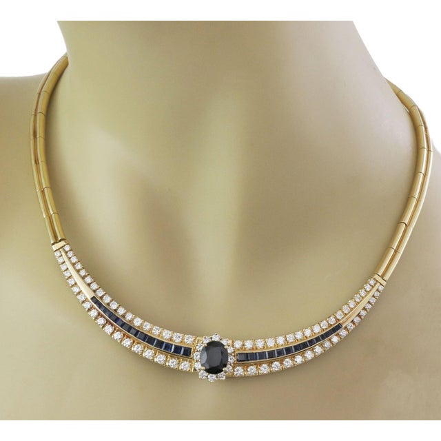 This is a stunning Estate collar necklace, crafted from 18k yellow gold featuring a 4 inches long curved centerpiece with...