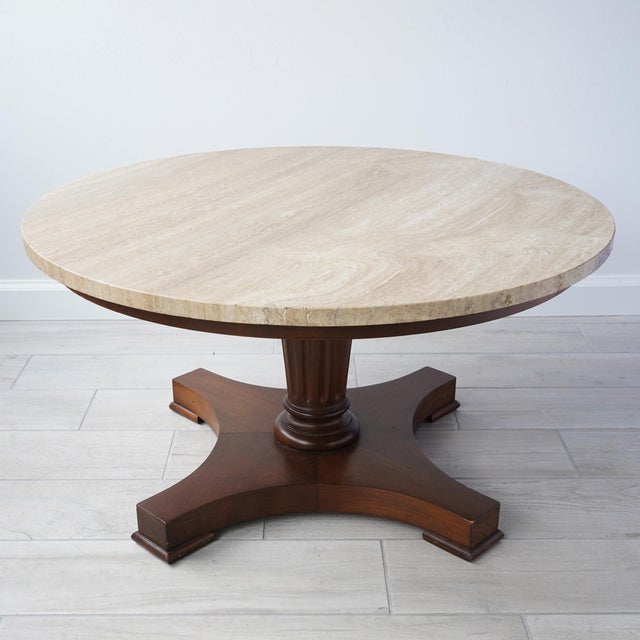 Vintage mid-century modern Italian travertine table with wood base circa 1950s. Table has a round piece of travertine on a...