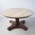 Vintage mid-century modern Italian travertine table with wood base circa 1950s. Table has a round piece of travertine on a...