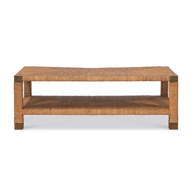 Artfully woven and impeccably composed, this two-tier coffee table celebrates texture as form. The frame is meticulously...