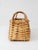 A vintage wicker basket featuring a narrow rectangular form with bentwood loop handles and an open-weave body in warm...