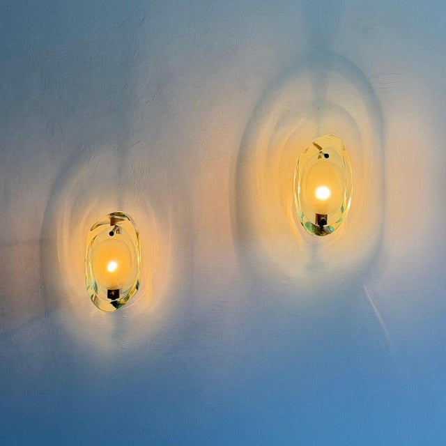 A superb and exceptionally rare pair of model 2093 wall sconces designed by max ingrand for fontana arte, italy, during...