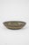A decorative stoneware bowl by Søholm featuring expressive hand-painted motifs in earthy blue and brown tones. The...