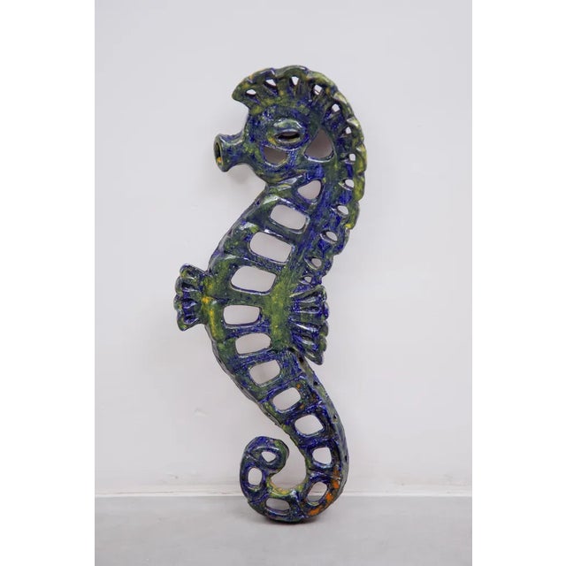 Blue seahorse ceramic wall sculpture was made in a workshop of Belgium, 1970s. Nice seahorse glazed in cobalt blue with...