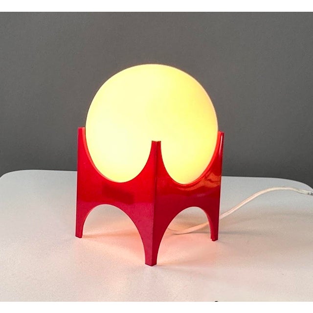 An iconic table lamp designed by Richard Essig, perfectly capturing the futuristic spirit of 1970s Space Age design. The...