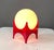 An iconic table lamp designed by Richard Essig, perfectly capturing the futuristic spirit of 1970s Space Age design. The...