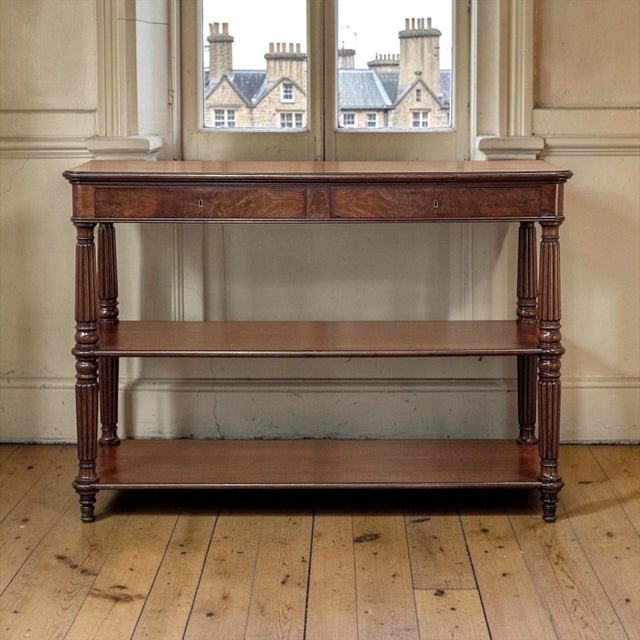 A 19th century English Regency mahogany etagere server with a deep, warm patina and the rich figure of fine mahogany. A...