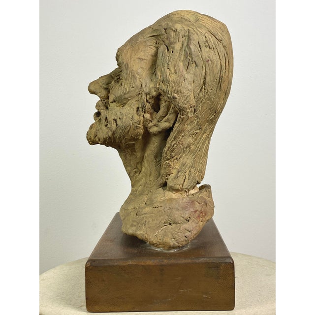 Mary Hecht (Canadian, 1931-2013) Signed Bust Clay Sculpture on Wood Pedestal. Figurative clay sculpture with the initials...
