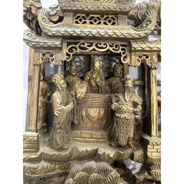Exquisite antique Chinese hand-carved wood panel depicting an elaborate battle scene in deep relief. A richly detailed...