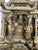 Exquisite antique Chinese hand-carved wood panel depicting an elaborate battle scene in deep relief. A richly detailed...