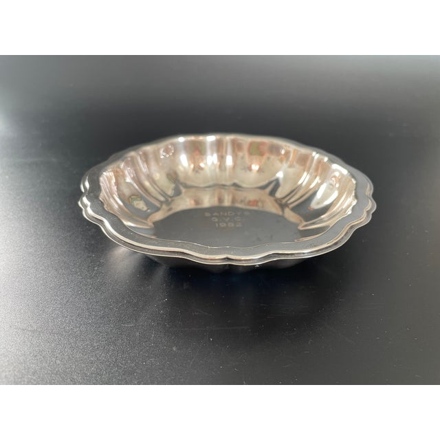 This scalloped bowl was produced by Oneida to complement their "Modern Baroque" flatware pattern, ideal for serving...