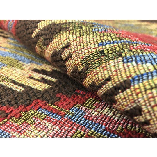 52" wide designer woven Southwestern ethnic tapestry ikat upholstery fabric in red, brown, olive green, and blue. Price is...