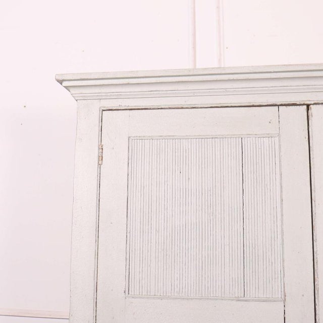 19th C painted Scandinavian style pine linen cupboard with reeded panels doors. 1830s. Dimensions:W: 132cm (52")H: 204.5cm...
