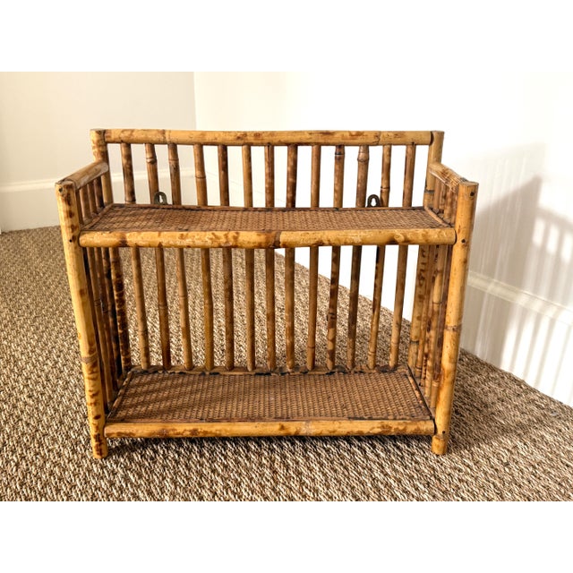 Rattan tortoise bamboo wall shelf or tabletop shelf. Woven grasscloth surfaces. Height between shelves measure 9.5"