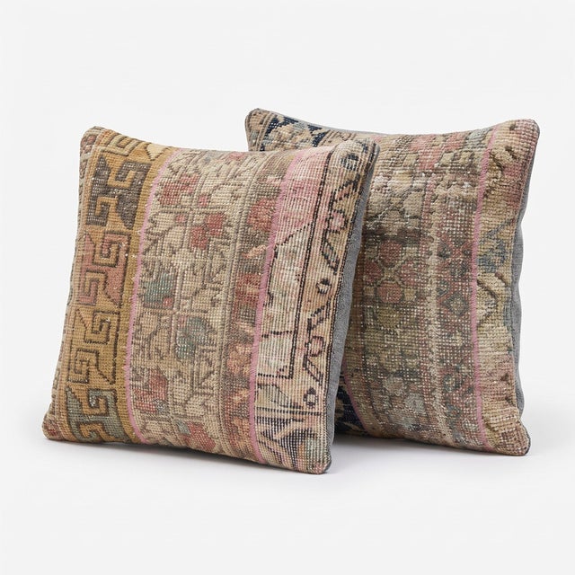 This 20'' x 20'' pillow cover set was made from authentic Turkish rug pieces — muted striped Oushak panels in dusty pink...