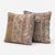 This 20'' x 20'' pillow cover set was made from authentic Turkish rug pieces — muted striped Oushak panels in dusty pink...