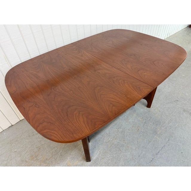 This listing is for a Mid-Century Modern Broyhill Brasilia Walnut Dining Table. Featuring an oval top design, sculpted...