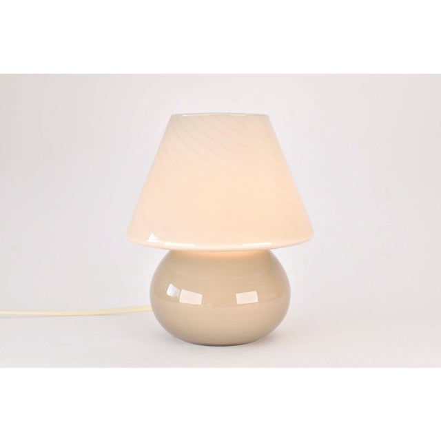 Beautiful Murano glass mushroom lamp, made around the 1970s. The mark of quality can be seen in the finishing of the...